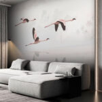 Fototapeten Gruppe von Flamingos fliegen über Wasser