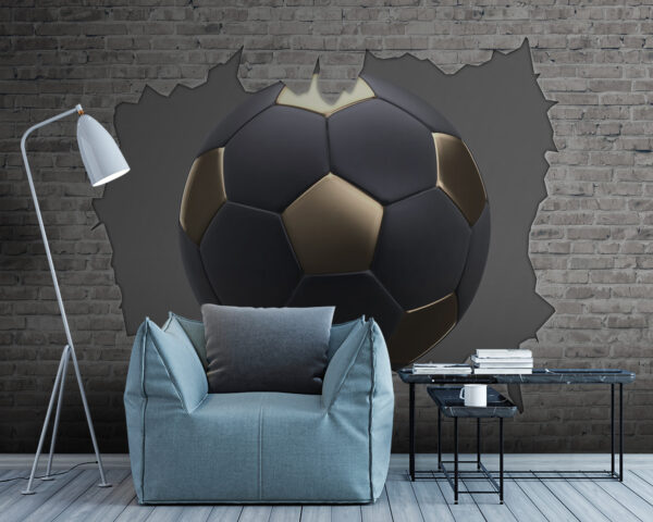Ein Fußball durchschlägt eine Mauer Fototapeten Ein Fußball durchschlägt eine Mauer