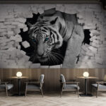 Fototapeten Tiger durchbricht weiße Backsteinmauer.
