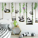 Fototapeten Gruppe von Pandas auf Schaukeln