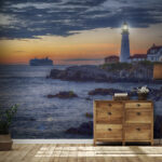 Fototapeten Leuchtturm an einer felsigen Küste mit einem Kreuzfahrtschiff im Hintergrund