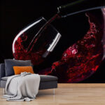 Fototapeten Ein Glas Rotwein wird eingeschenkt
