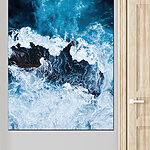 Wandbilder Wellen brechen an einem Felsen