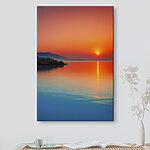 Wandbilder Canvas prints Sunset over a body of water