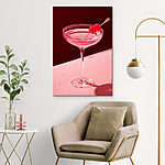 Wandbilder Glas mit rosa Flüssigkeit und zwei Kirschen darauf