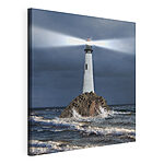 Wandbilder Leuchtturm auf einem Felsen im Meer